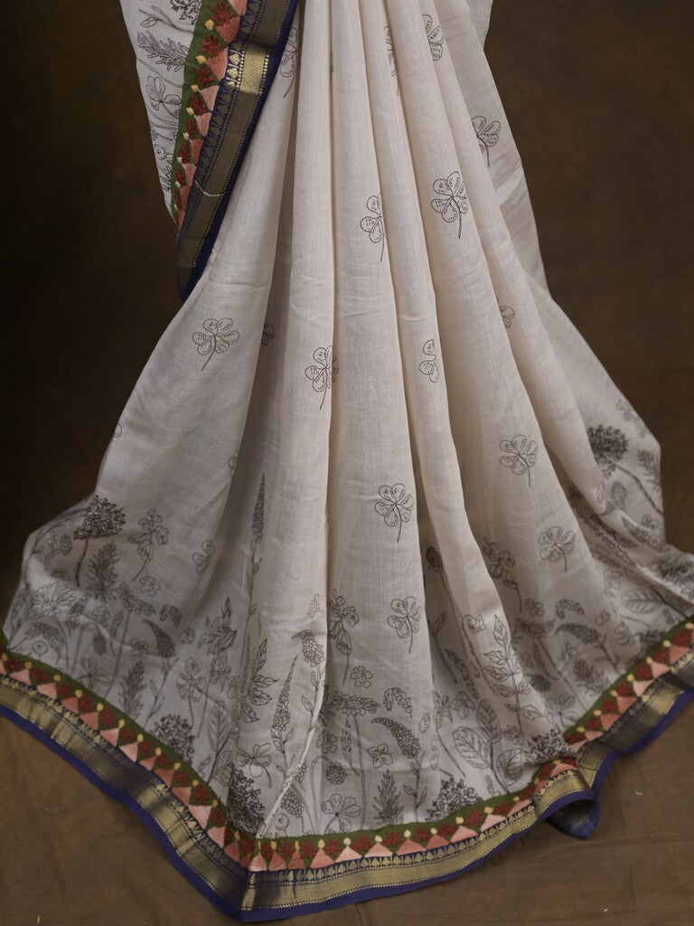 Maheshwari fancy saree in white color with allover prints & zari border with short pallu and contrast blouse