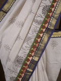 Maheshwari fancy saree in white color with allover prints & zari border with short pallu and contrast blouse