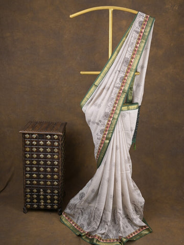 Maheshwari fancy saree in white color with allover prints & zari border with short pallu and contrast blouse