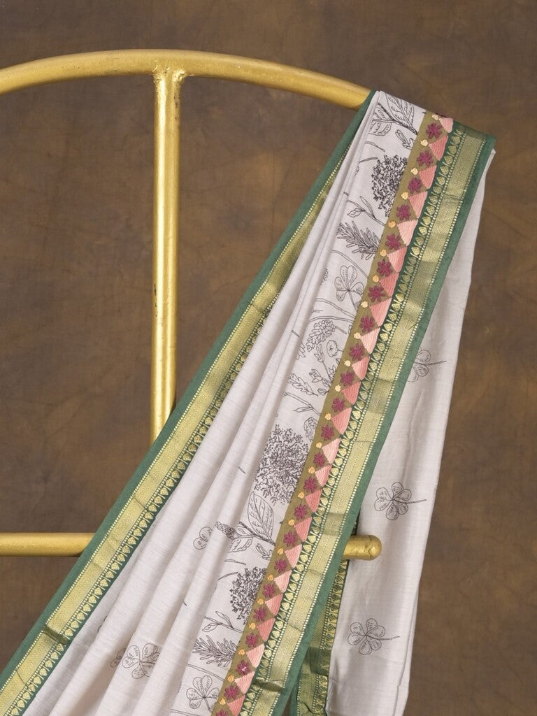 Maheshwari fancy saree in white color with allover prints & zari border with short pallu and contrast blouse