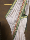 Maheshwari fancy saree in white color with allover prints & zari border with short pallu and contrast blouse