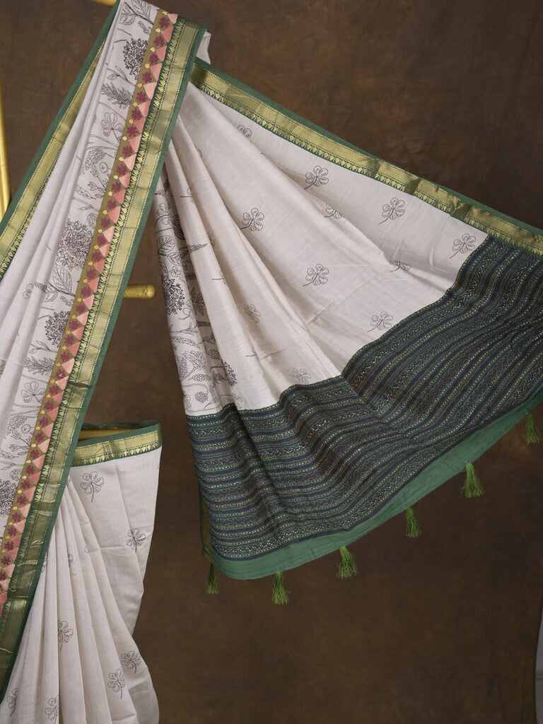 Maheshwari fancy saree in white color with allover prints & zari border with short pallu and contrast blouse