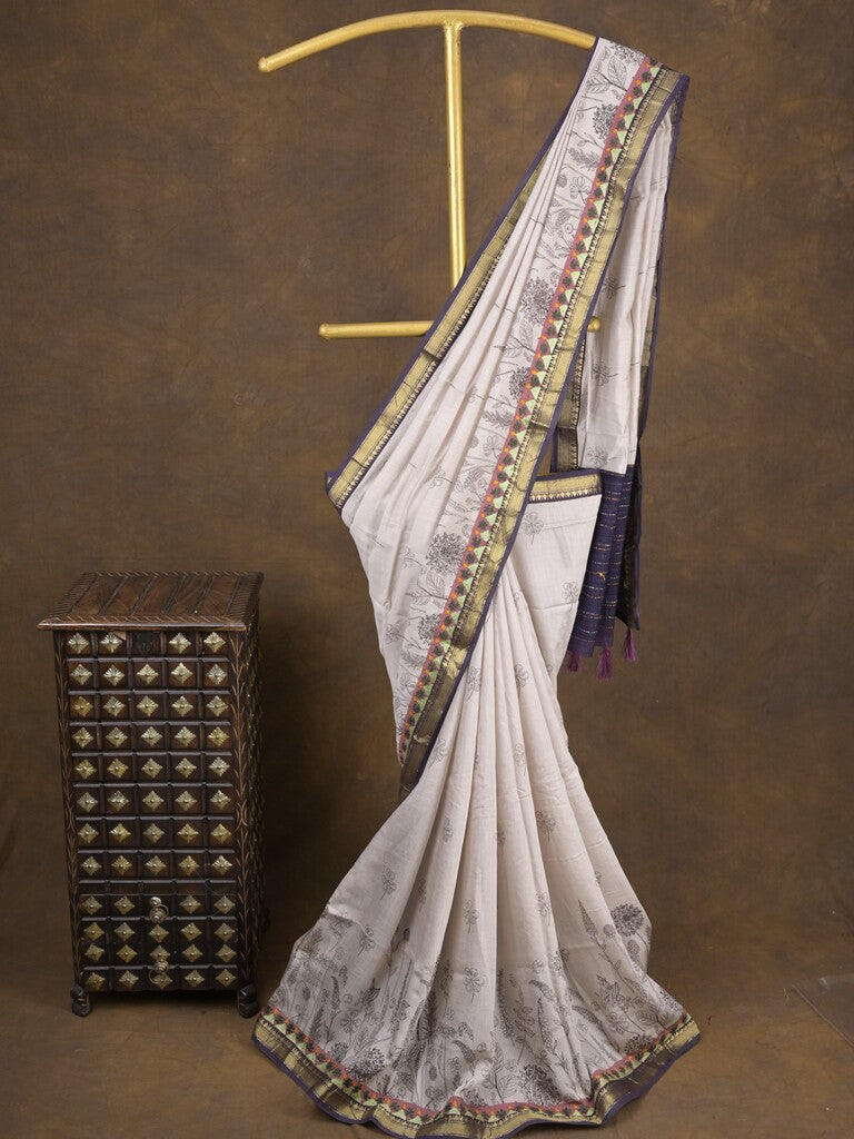 Maheshwari fancy saree in white color with allover prints & zari border with short pallu and contrast blouse