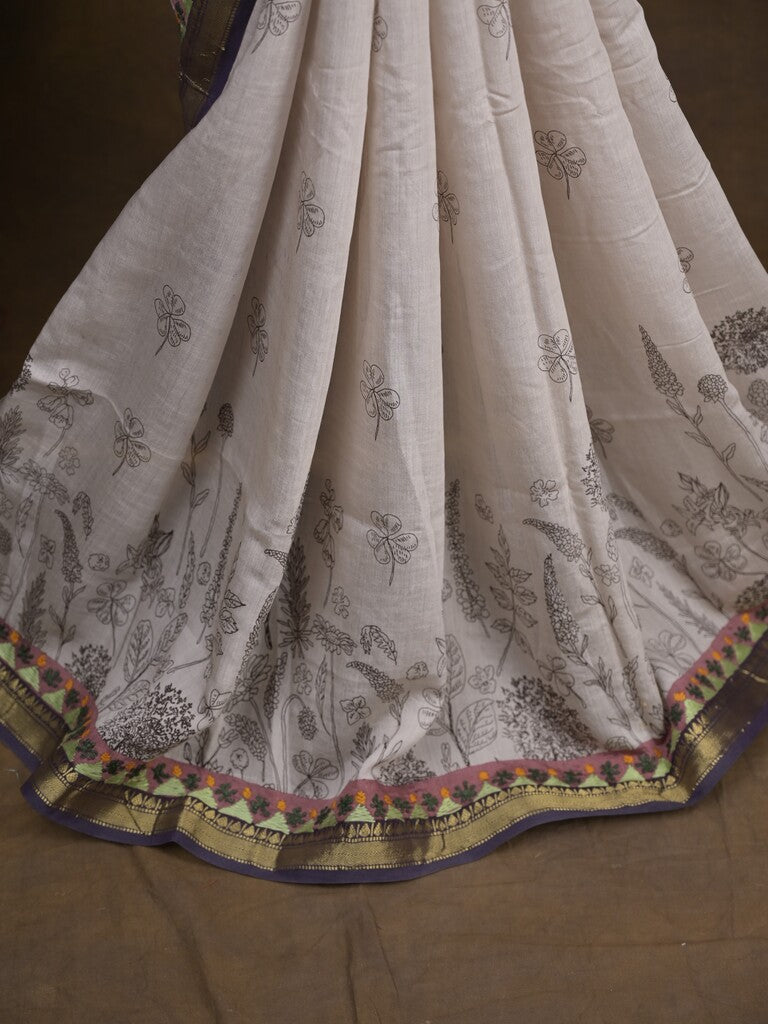 Maheshwari fancy saree in white color with allover prints & zari border with short pallu and contrast blouse