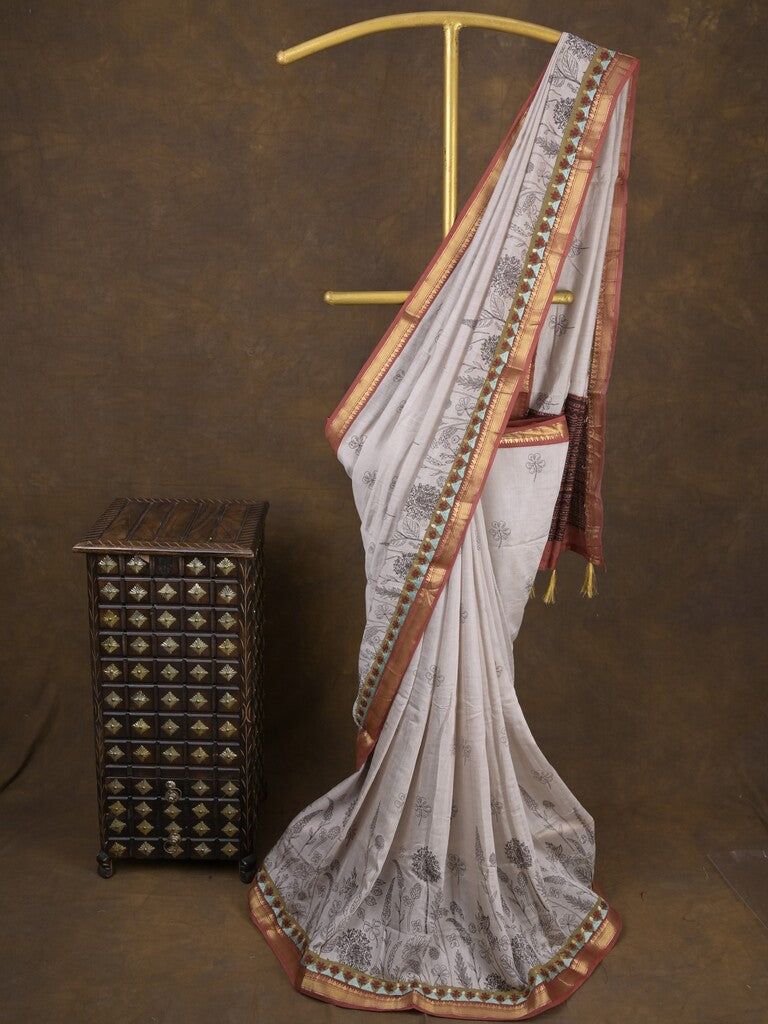Maheshwari fancy saree in white color with allover prints & zari border with short pallu and contrast blouse