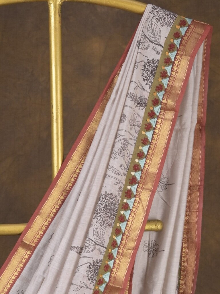 Maheshwari fancy saree in white color with allover prints & zari border with short pallu and contrast blouse