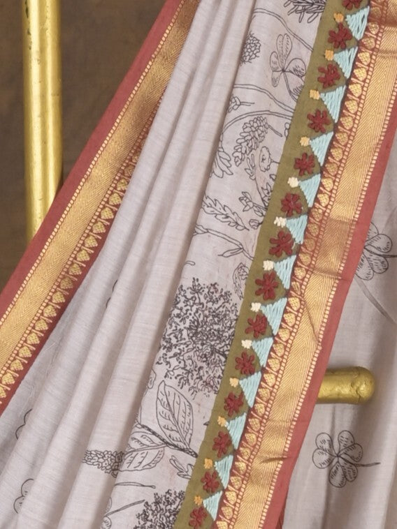 Maheshwari fancy saree in white color with allover prints & zari border with short pallu and contrast blouse