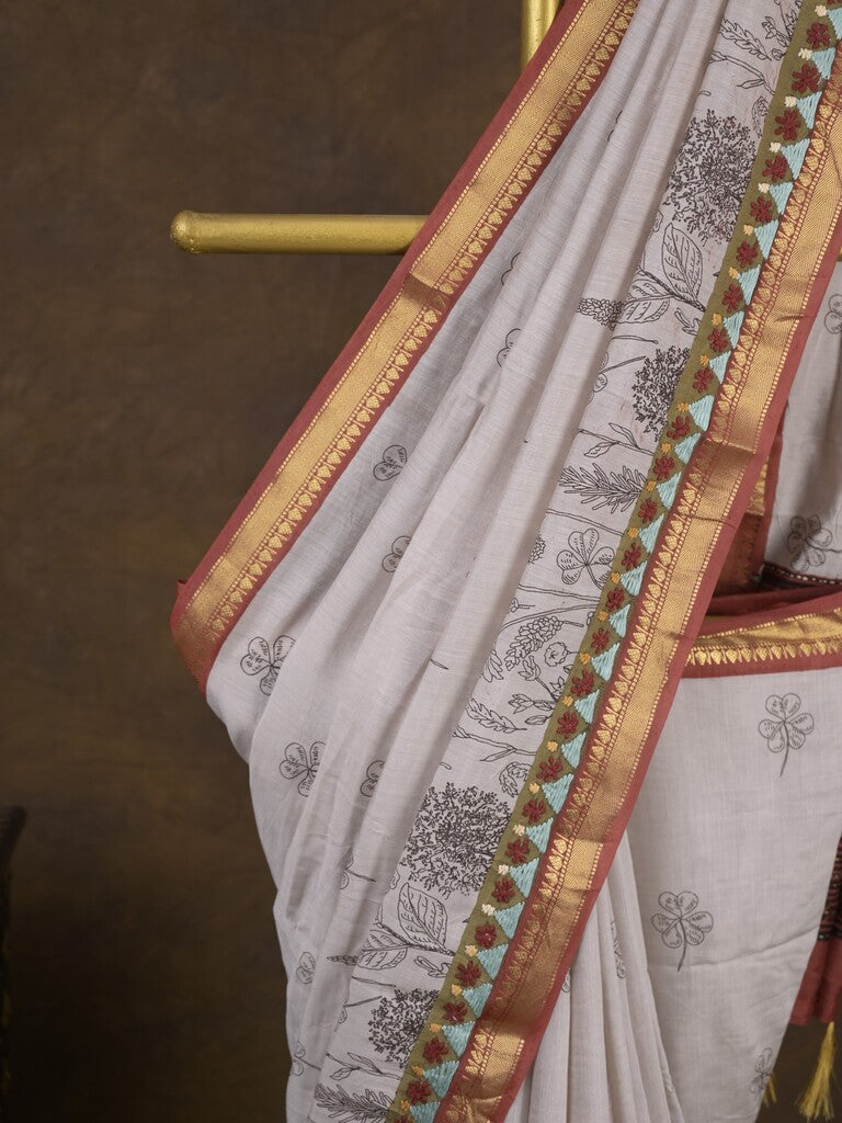 Maheshwari fancy saree in white color with allover prints & zari border with short pallu and contrast blouse