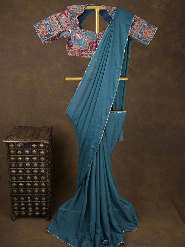 Blue color chinnon plain fancy saree with fancy border and embroidery stitched blouse