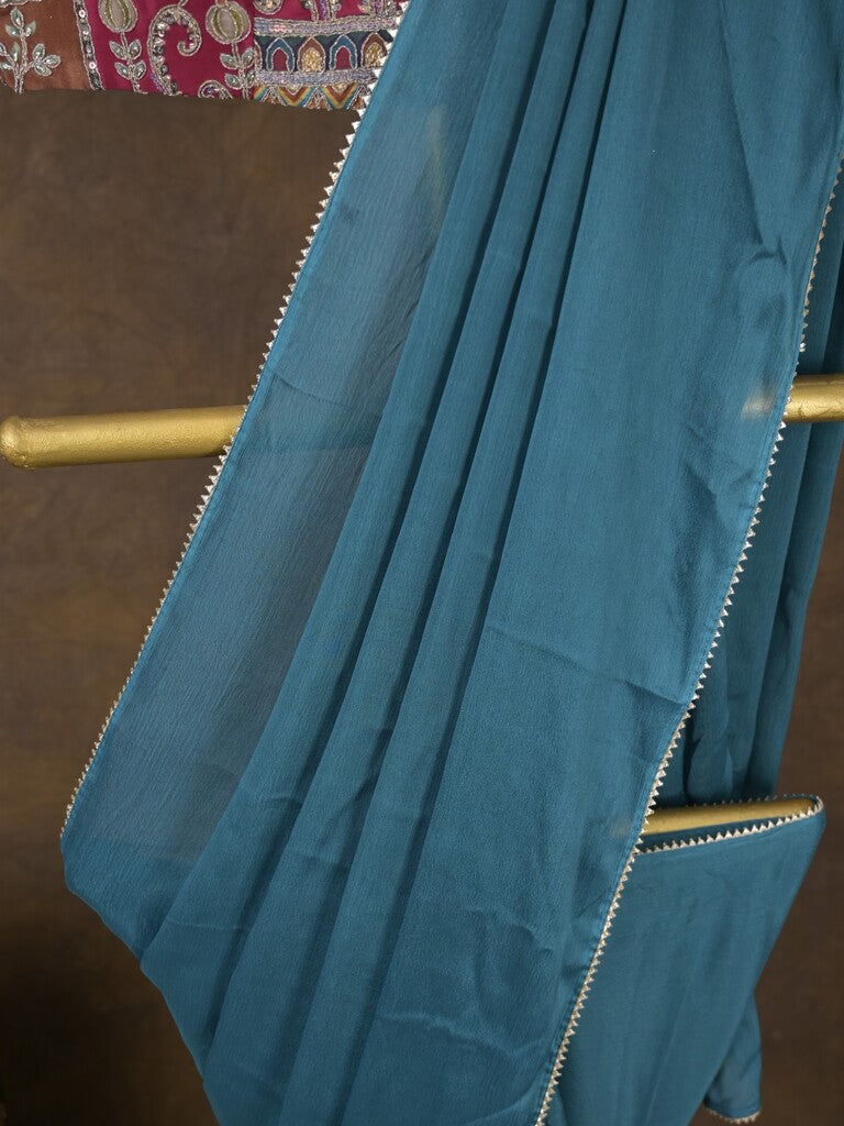 Blue color chinnon plain fancy saree with fancy border and embroidery stitched blouse