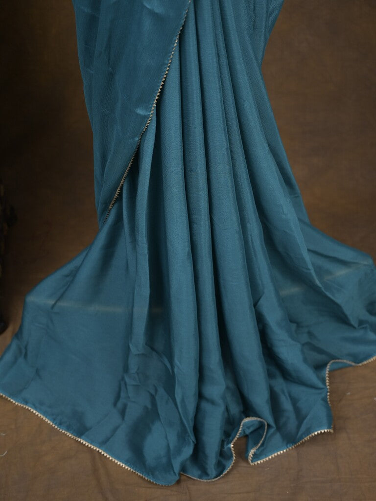 Blue color chinnon plain fancy saree with fancy border and embroidery stitched blouse