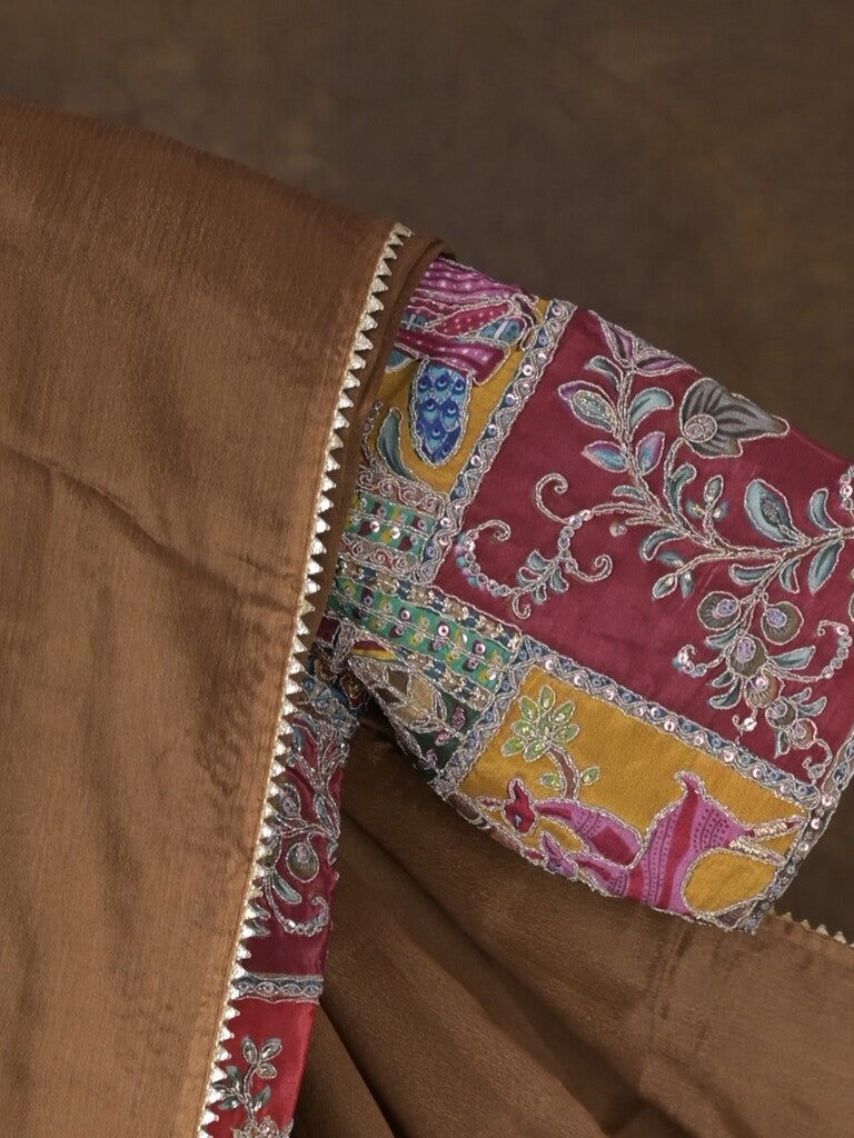 Brown color chinnon plain fancy saree with fancy border and embroidery stitched blouse