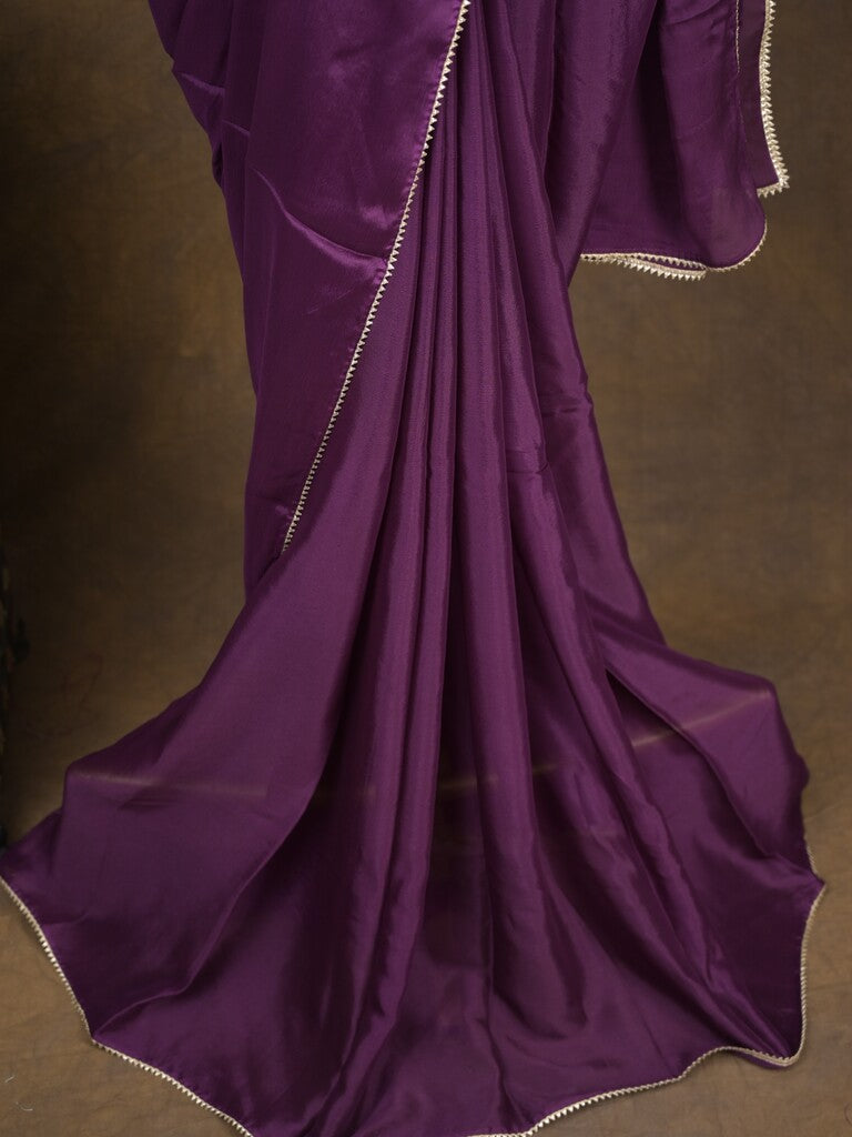 Purple color chinnon plain fancy saree with fancy border and embroidery stitched blouse
