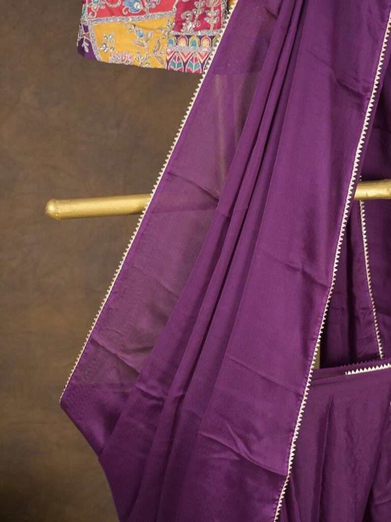 Purple color chinnon plain fancy saree with fancy border and embroidery stitched blouse