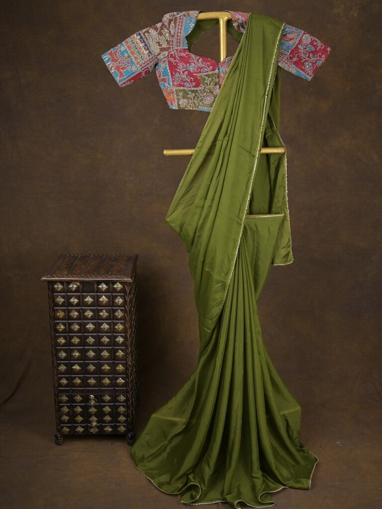 Green color chinnon plain fancy saree with fancy border and embroidery stitched blouse
