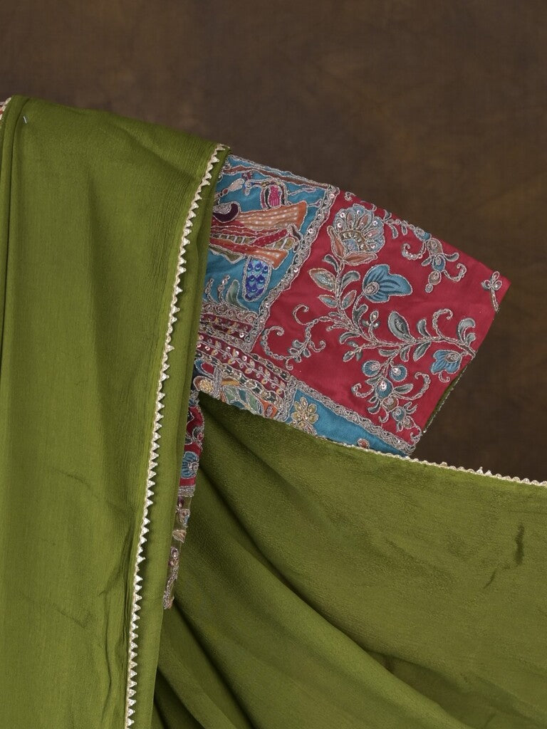 Green color chinnon plain fancy saree with fancy border and embroidery stitched blouse
