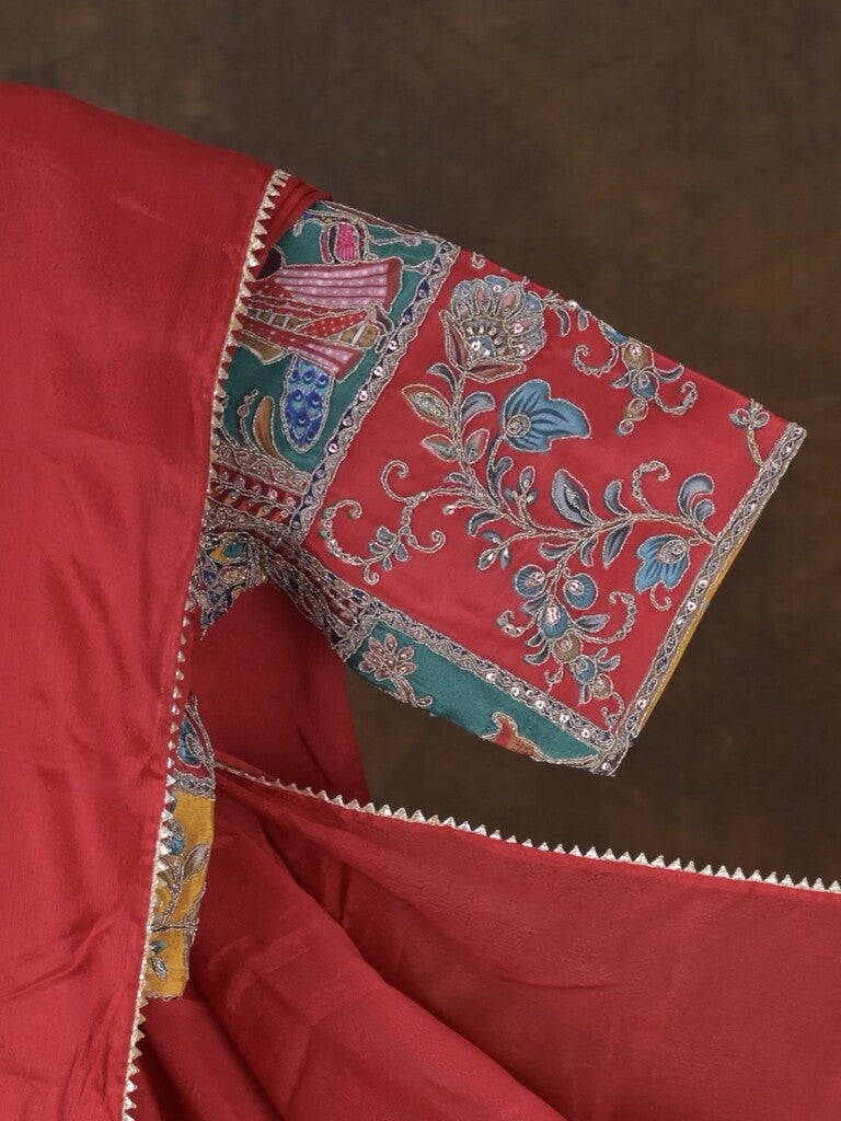 Red color chinnon plain fancy saree with fancy border and embroidery stitched blouse