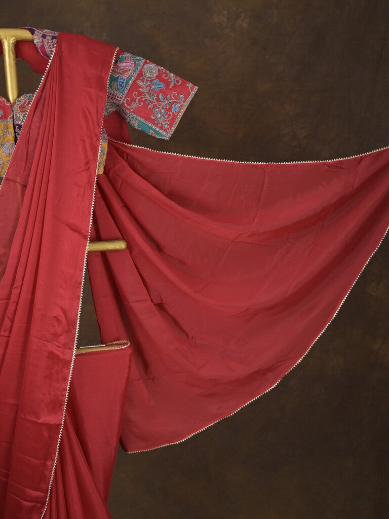 Red color chinnon plain fancy saree with fancy border and embroidery stitched blouse