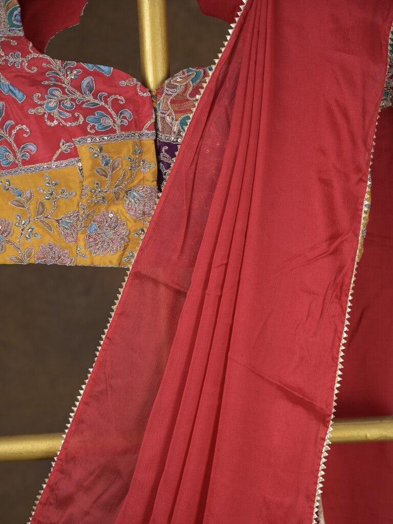 Red color chinnon plain fancy saree with fancy border and embroidery stitched blouse
