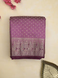 Dupion fancy saree in purple color allover zari motifs & zari border with zari pallu and attached contrast blouse