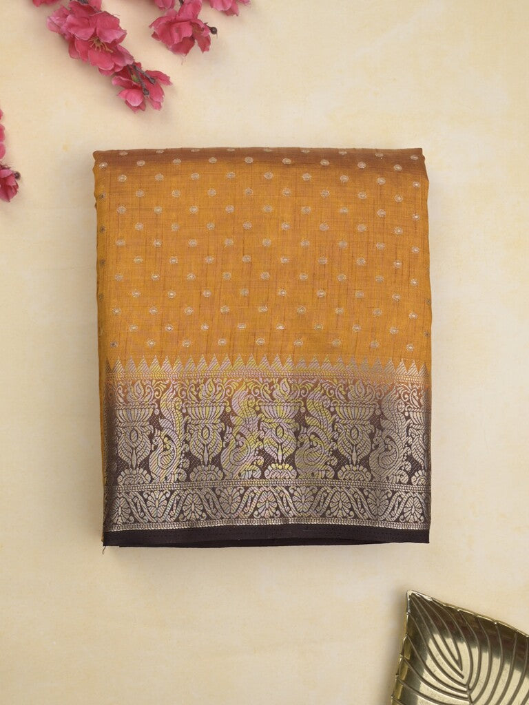 Dupion fancy saree in golden yellow color allover zari motifs & zari border with zari pallu and attached contrast blouse