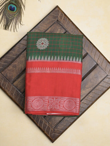 Banaras fancy saree in bottle green color allover zari motifs & zari border with brocade pallu and attached blouse