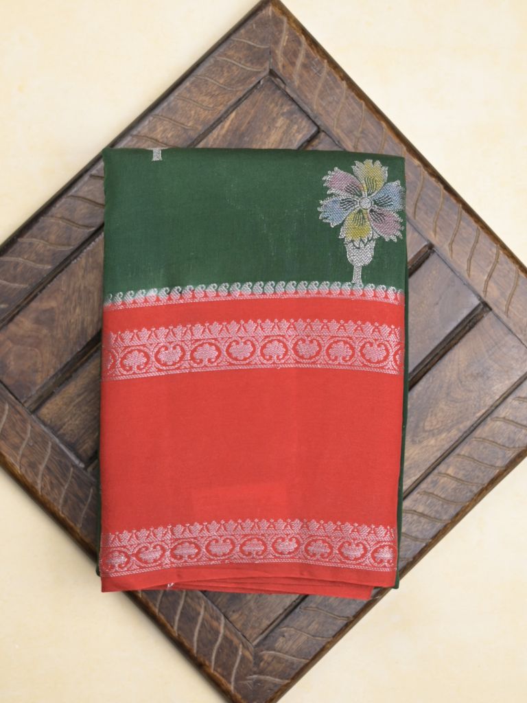 Banaras fancy saree in bottle green color allover zari motifs & zari border with brocade pallu and attached blouse