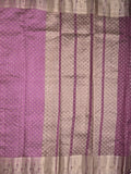 Dupion fancy saree in purple color allover zari motifs & zari border with zari pallu and attached contrast blouse