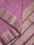 Dupion fancy saree in purple color allover zari motifs & zari border with zari pallu and attached contrast blouse
