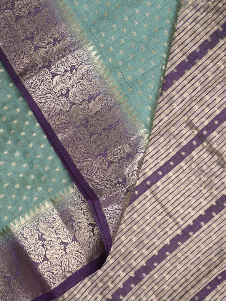 Dupion fancy saree in lux green color allover zari motifs & zari border with zari pallu and attached contrast blouse