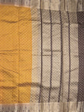 Dupion fancy saree in golden yellow color allover zari motifs & zari border with zari pallu and attached contrast blouse