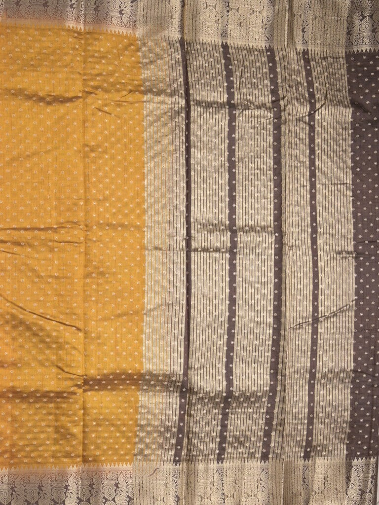 Dupion fancy saree in golden yellow color allover zari motifs & zari border with zari pallu and attached contrast blouse