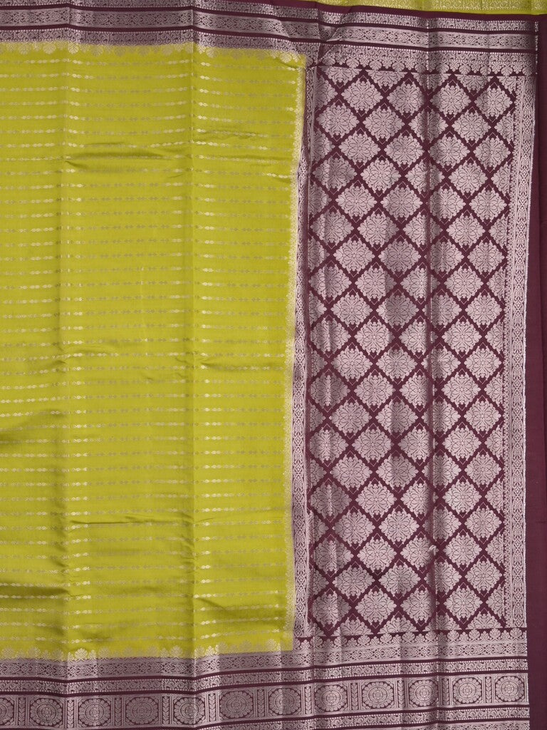 Banaras fancy saree in parrot green color allover zari stripes & zari border with zari pallu and attached contrast blouse