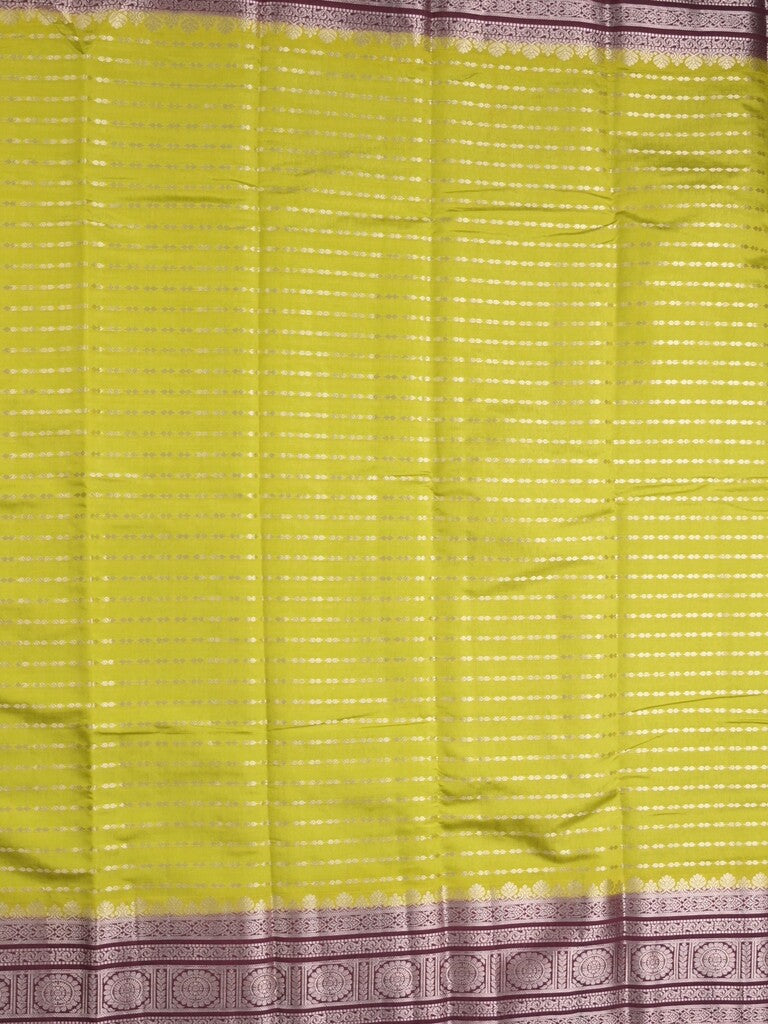 Banaras fancy saree in parrot green color allover zari stripes & zari border with zari pallu and attached contrast blouse