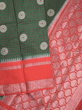 Banaras fancy saree in bottle green color allover zari motifs & zari border with brocade pallu and attached blouse