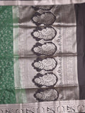 Kanchi pattu saree bottle green color allover zari weaves & zari border with rich pallu and plain blouse