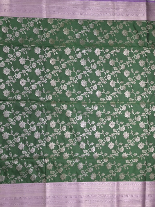 Kanchi pattu saree bottle green color allover zari weaves & zari border with rich pallu and plain blouse