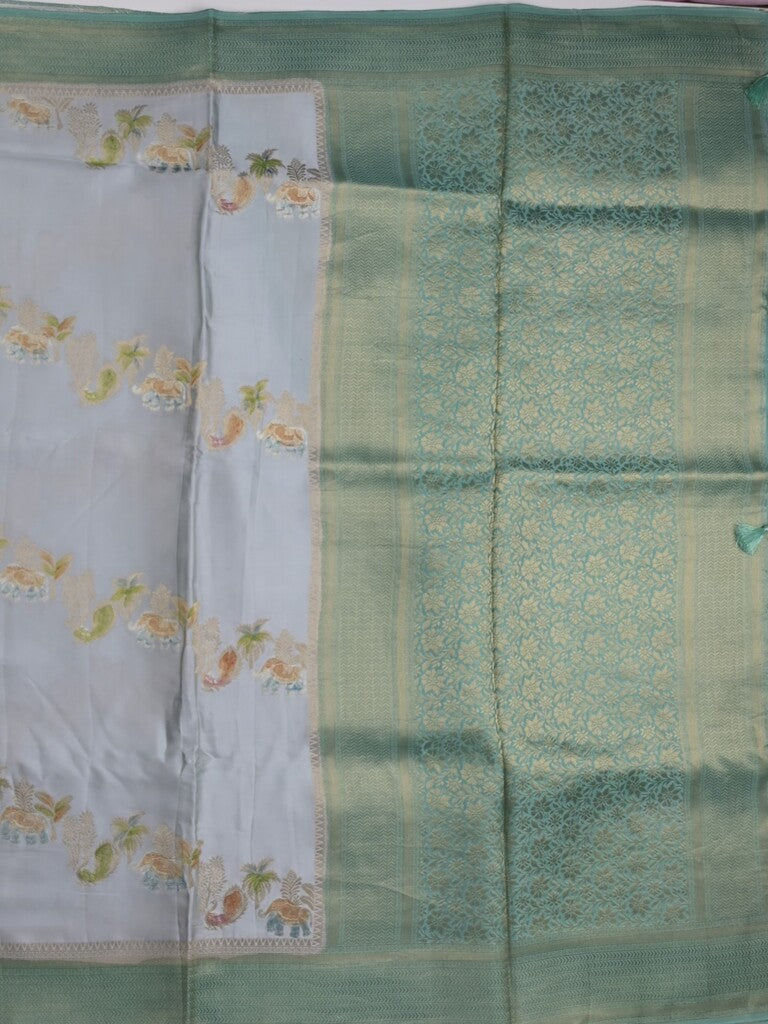 Satin silk fancy saree light blue color allover zari weaves & zari border with zari pallu and plain self blouse