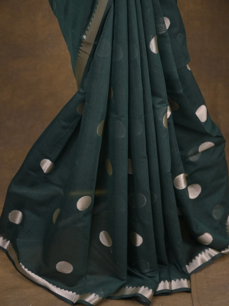 Maheshwari fancy saree in dark green color allover zari motifs & zari border with zari and plain blouse