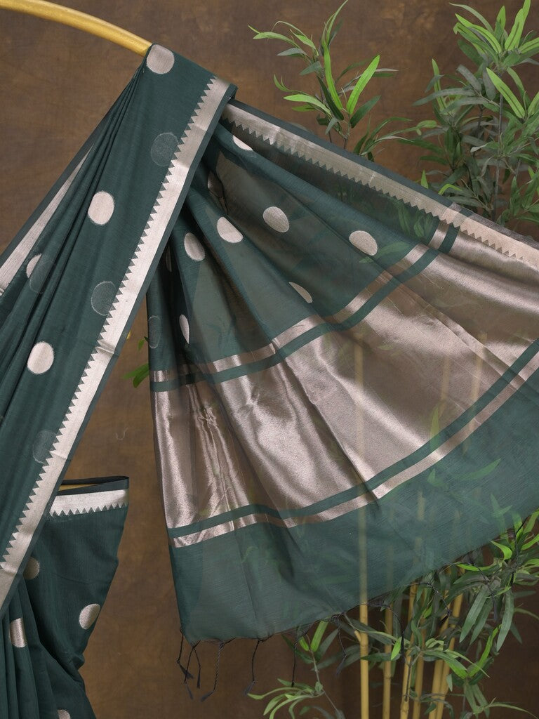Maheshwari fancy saree in dark green color allover zari motifs & zari border with zari and plain blouse