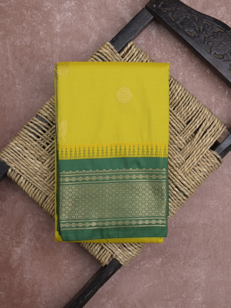 Gadwal pattu saree in yellow color allover zari motifs & zari border with rich pallu and plain blouse