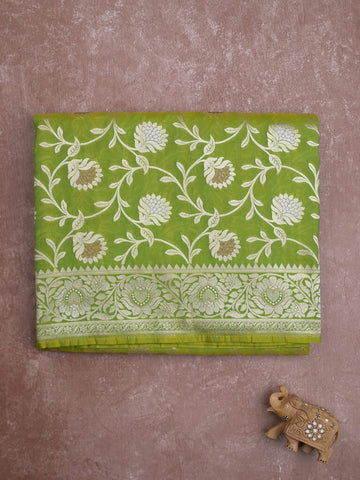 Banaras pattu saree in parrot green color allover zari weaves & zari border with rich pallu and striped blouse