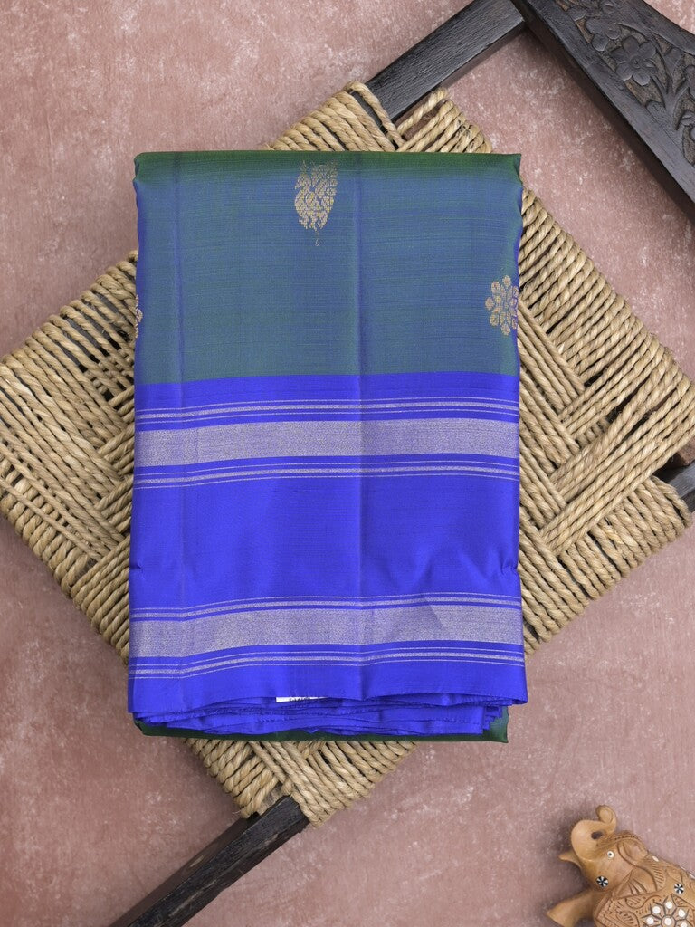 Kanchi pattu saree in peacock blue color allover zari motifs & zari border with rich pallu and plain blouse