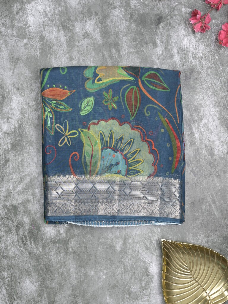 Georgette fancy saree peacock blue color allover prints & zari border with zari pallu and plain blouse