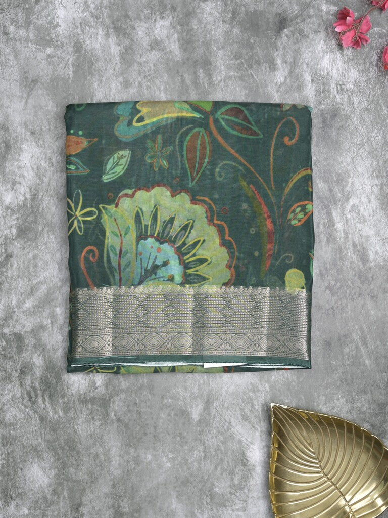 Georgette fancy saree dark green color allover prints & zari border with zari pallu and plain blouse