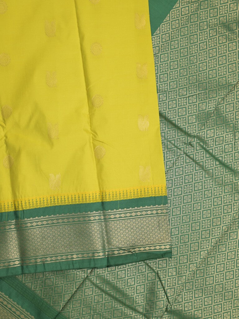 Gadwal pattu saree in yellow color allover zari motifs & zari border with rich pallu and plain blouse