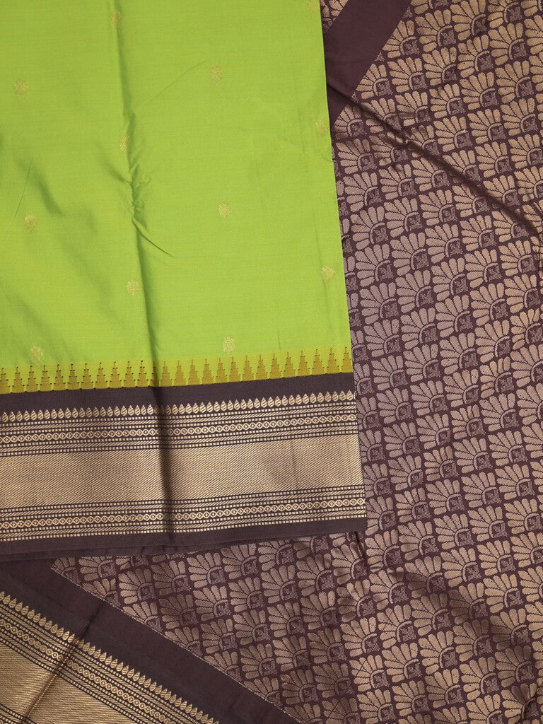 Gadwal pattu saree in parrot green color allover zari motifs & zari border with rich pallu and plain blouse