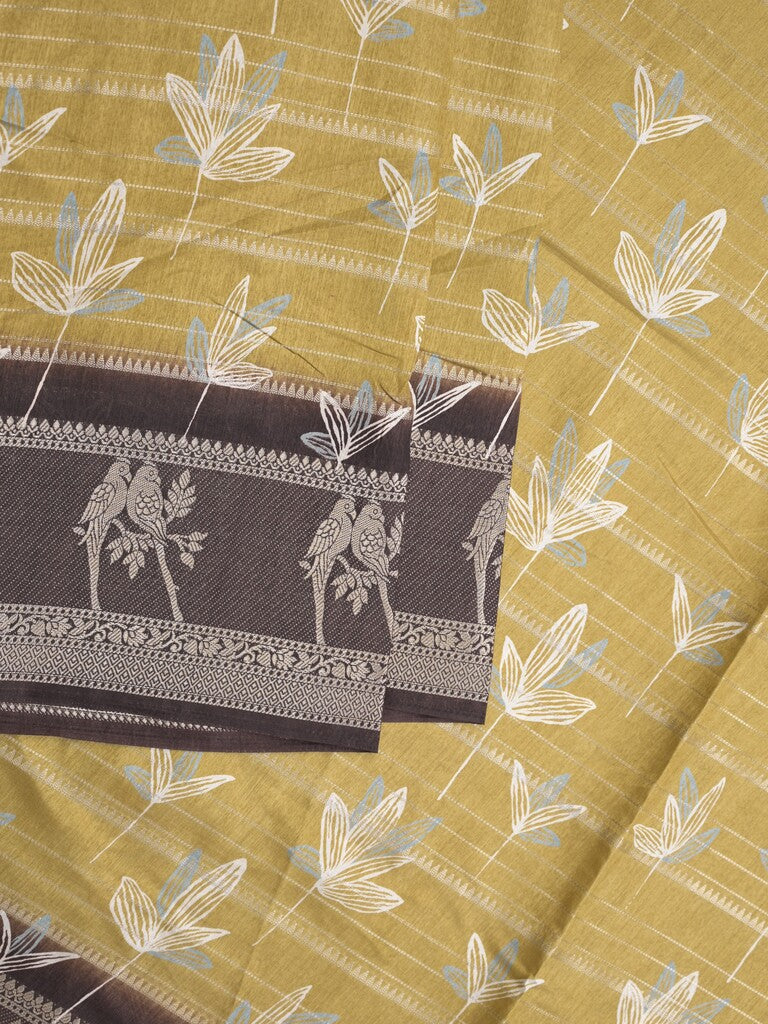 Dola silk fancy saree light mustard yellow color allover prints & contrast zari border with printed pallu and printed blouse