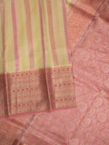 Kanchi kora pattu saree in cream color allover zari stripes & zari border with rich pallu and plain blouse