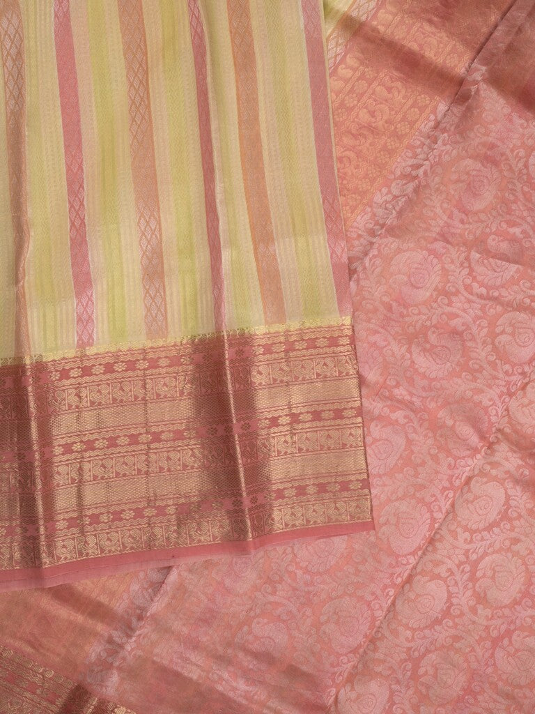 Kanchi kora pattu saree in cream color allover zari stripes & zari border with rich pallu and plain blouse